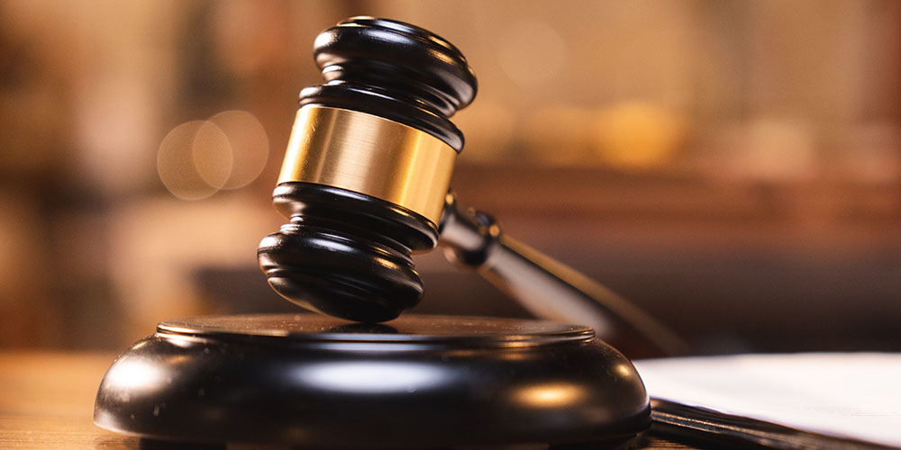 Promo image for the Courts section of the website. Image of a judge's gavel.
