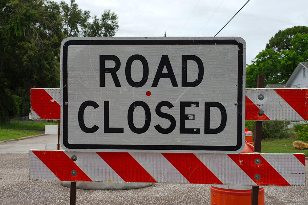 a road closed sign.