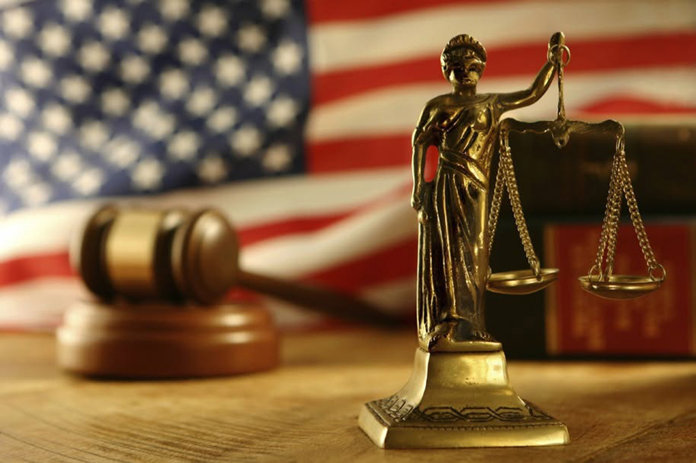 a gavel with the scales of justice.
